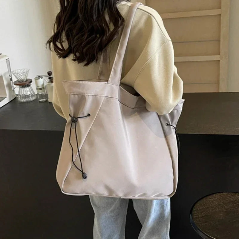 SUVETTE beige large capacity drawstring tote bag worn