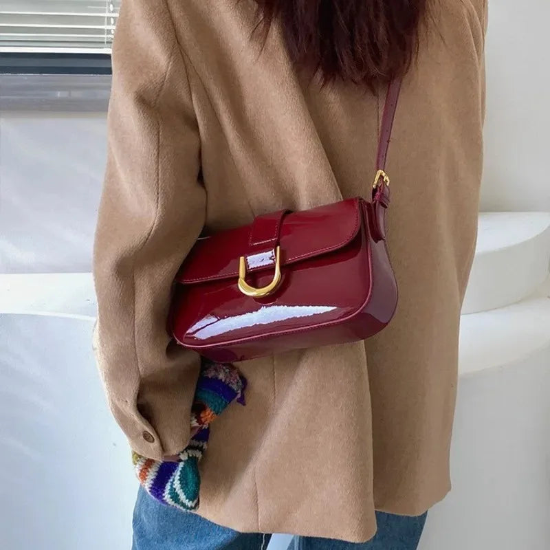 SUVETTE red leather horseshoe buckle shoulder bag worn
