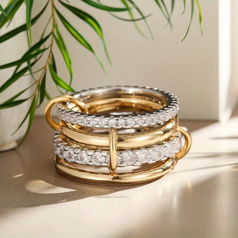SUVETTE stacked gold and cubic zirconia rings closeup