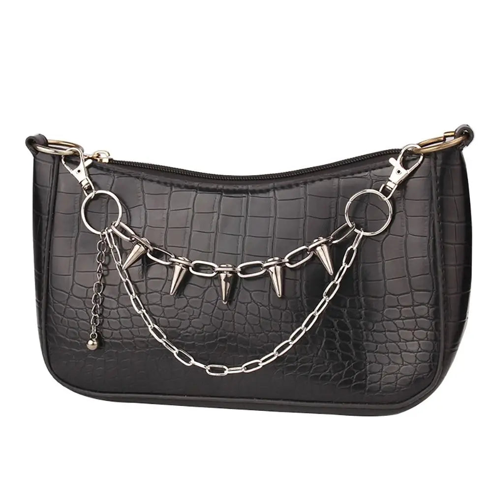 SUVETTE layered spiked chain on black handbag