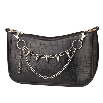 SUVETTE layered spiked chain on black handbag