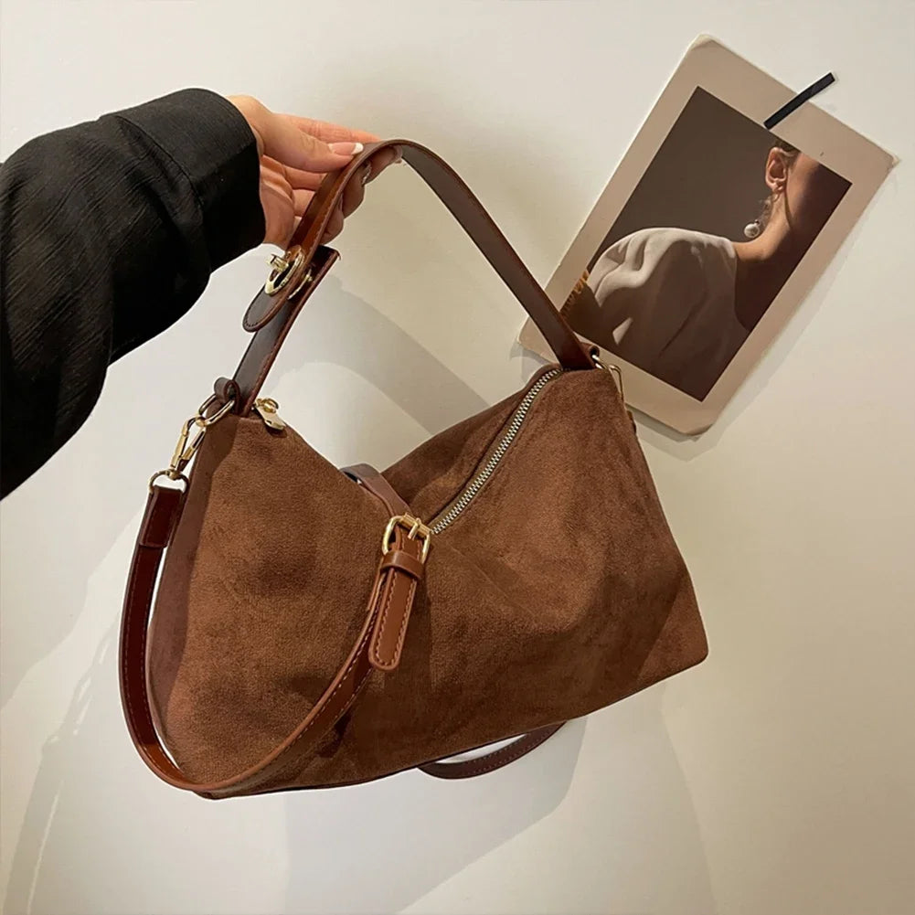 SUVETTE brown suede shoulder bag held up