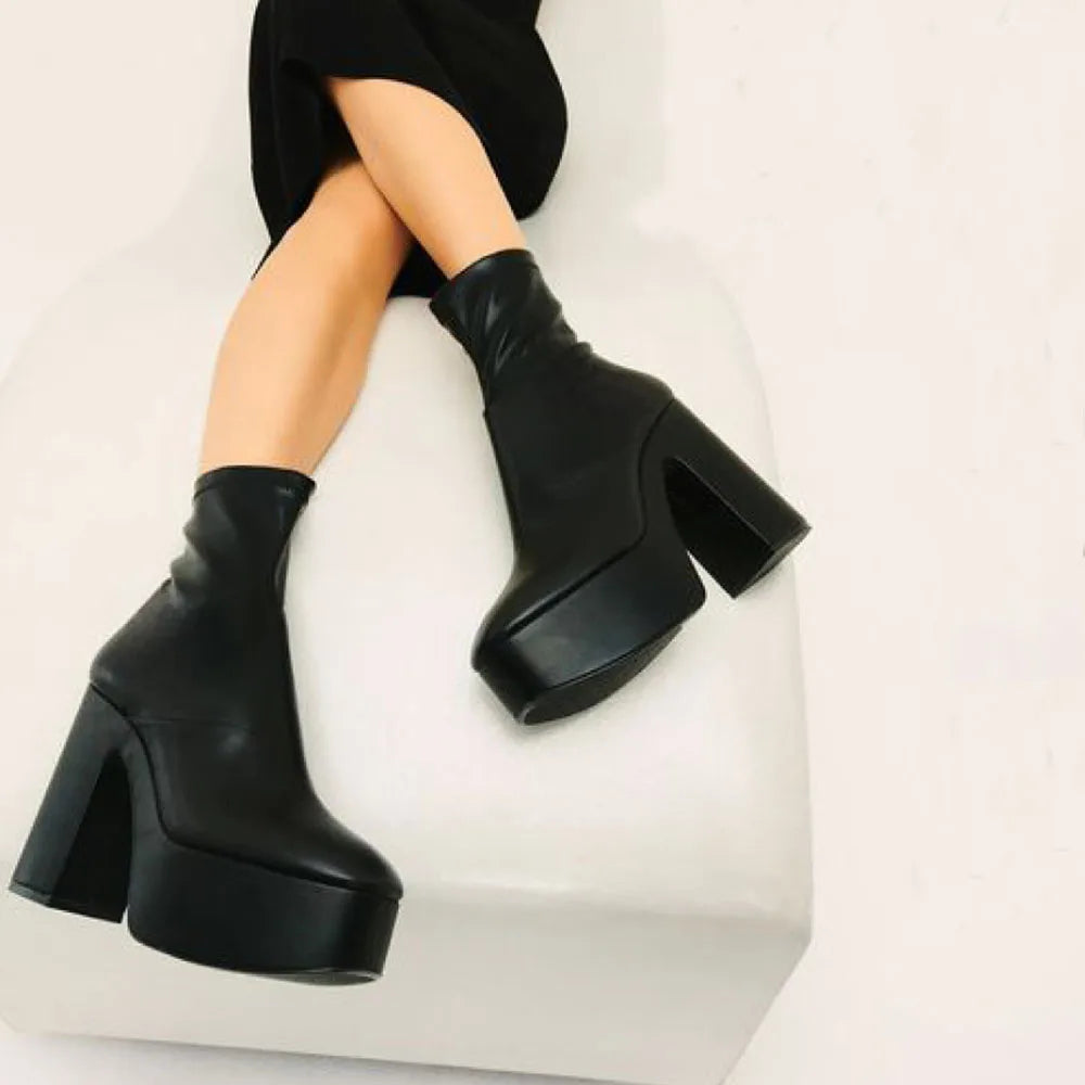 SUVETTE black platform boots worn sitting down