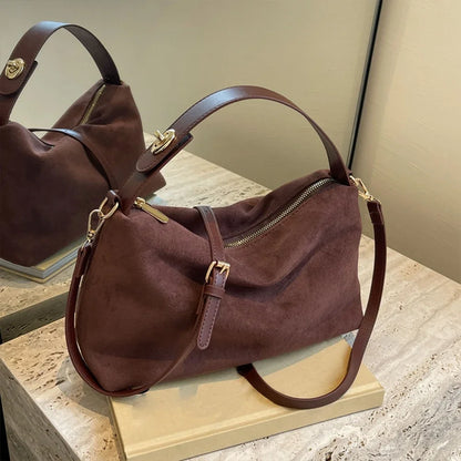 SUVETTE dark brown suede shoulder bag on table