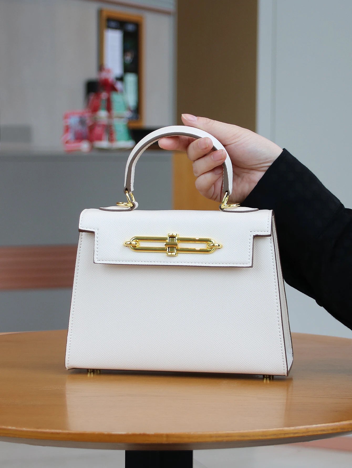 SUVETTE white structured handbag held by handle