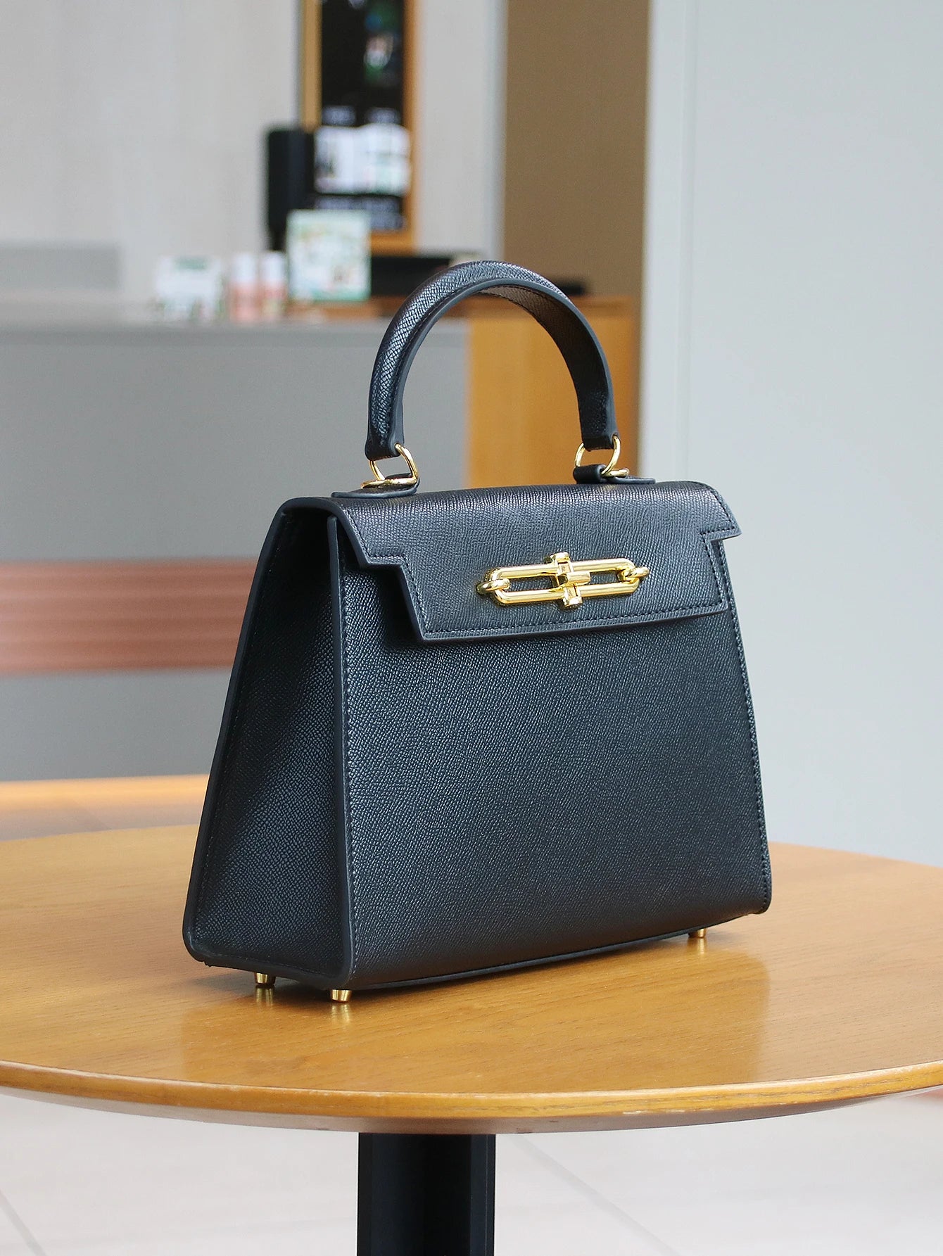 SUVETTE black structured top-handle handbag with gold clasp