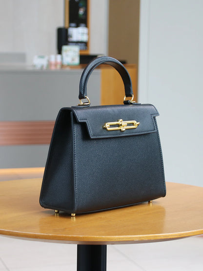 SUVETTE black structured top-handle handbag with gold clasp