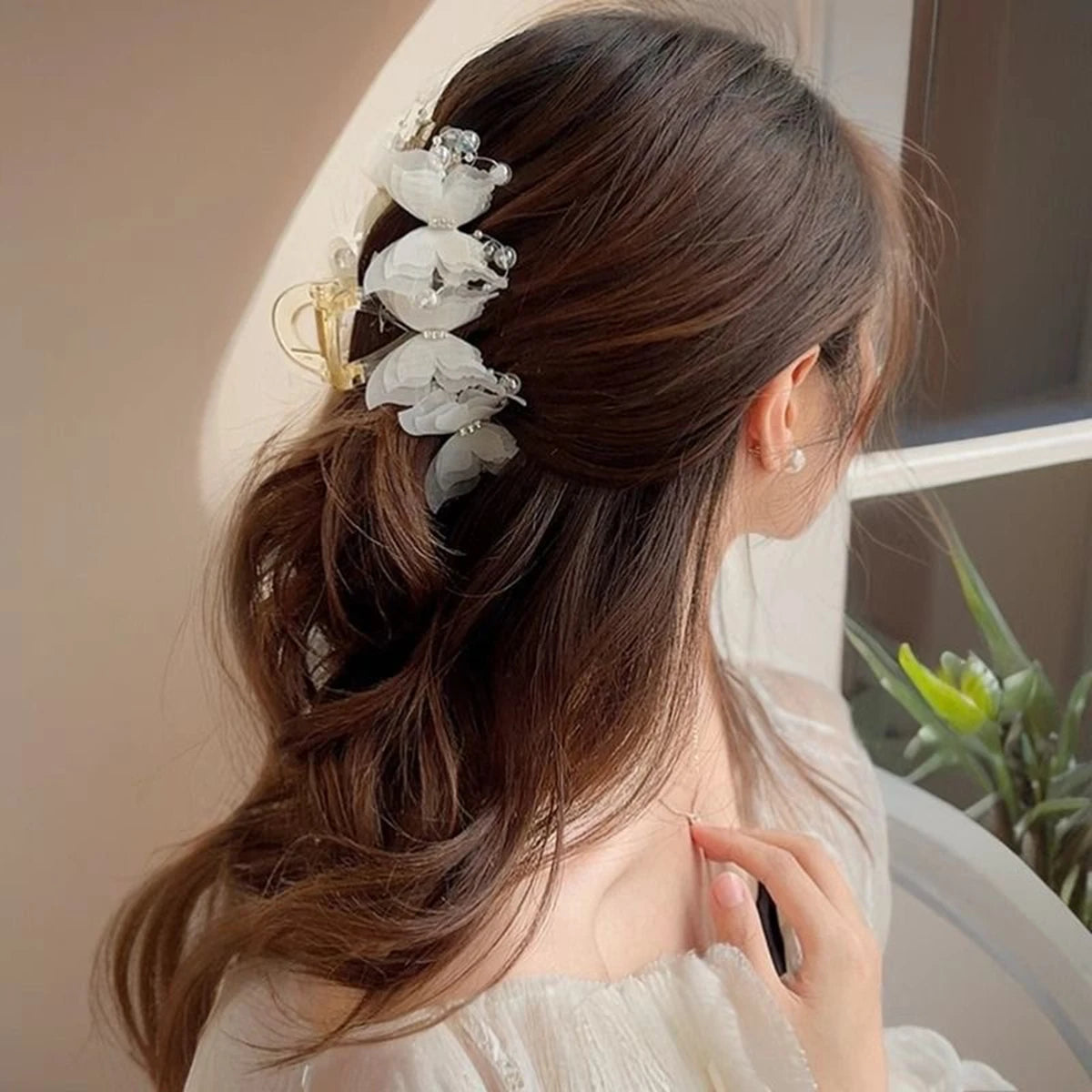 SUVETTE white butterfly hair clip worn