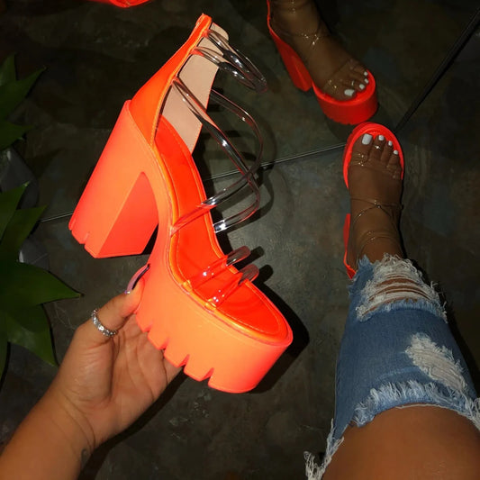 SUVETTE orange platform heel held up with outfit